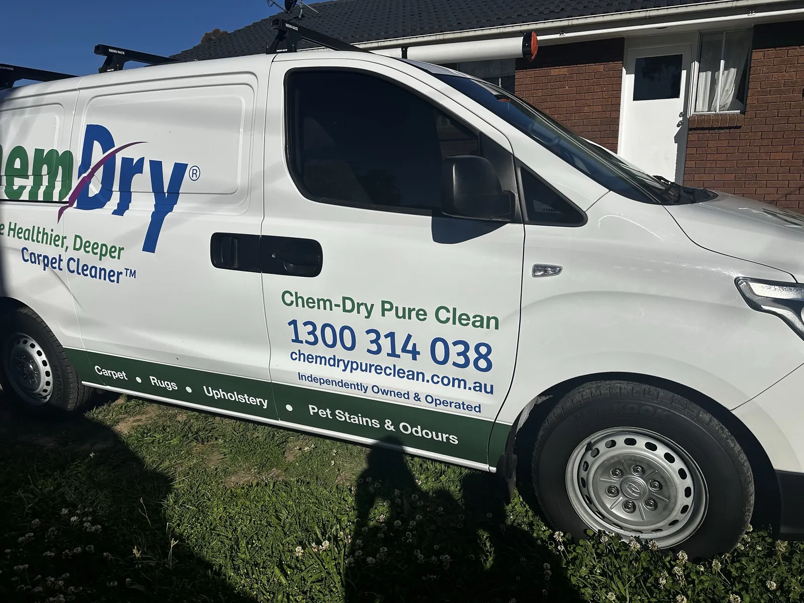 Shaun's Chem-Dry Pure Clean van parked on the grass outside a red-brick Canberra home, showing the Chem-Dry Pure Clean name and 1300 314 038