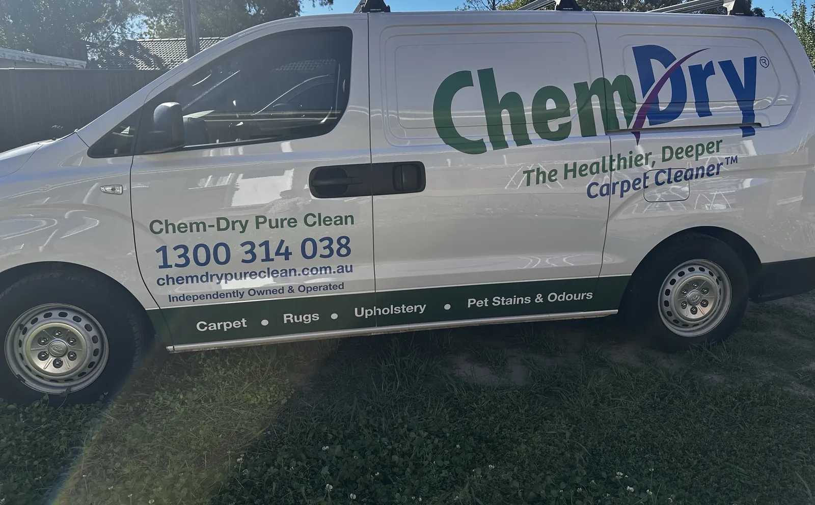 Side view of Shaun's white Chem-Dry Pure Clean van, with 1300 314 038 and chemdrypureclean.com.au on the door and Carpet, Rugs, Upholstery, Pet Stains & Odours along the base