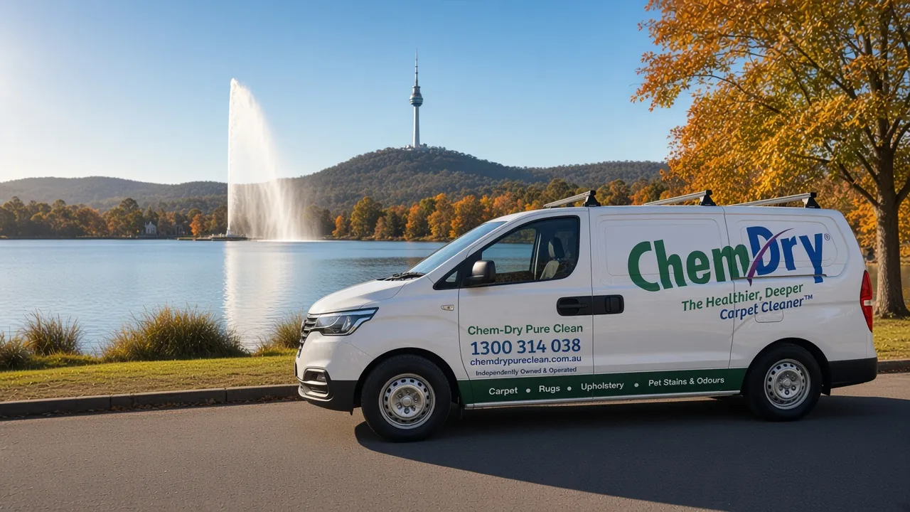 The white Chem-Dry Pure Clean van, showing 1300 314 038, parked beside Lake Burley Griffin in autumn with the Captain Cook Memorial Jet and Telstra Tower on Black Mountain behind